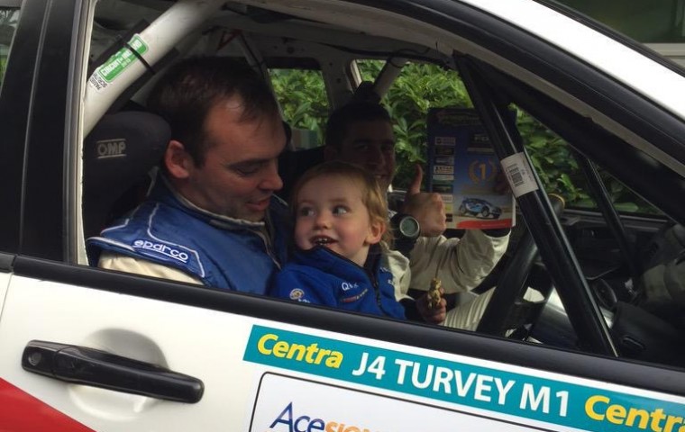 <span class="light">Aaron</span> with his son and Paul McGee Group N Champions